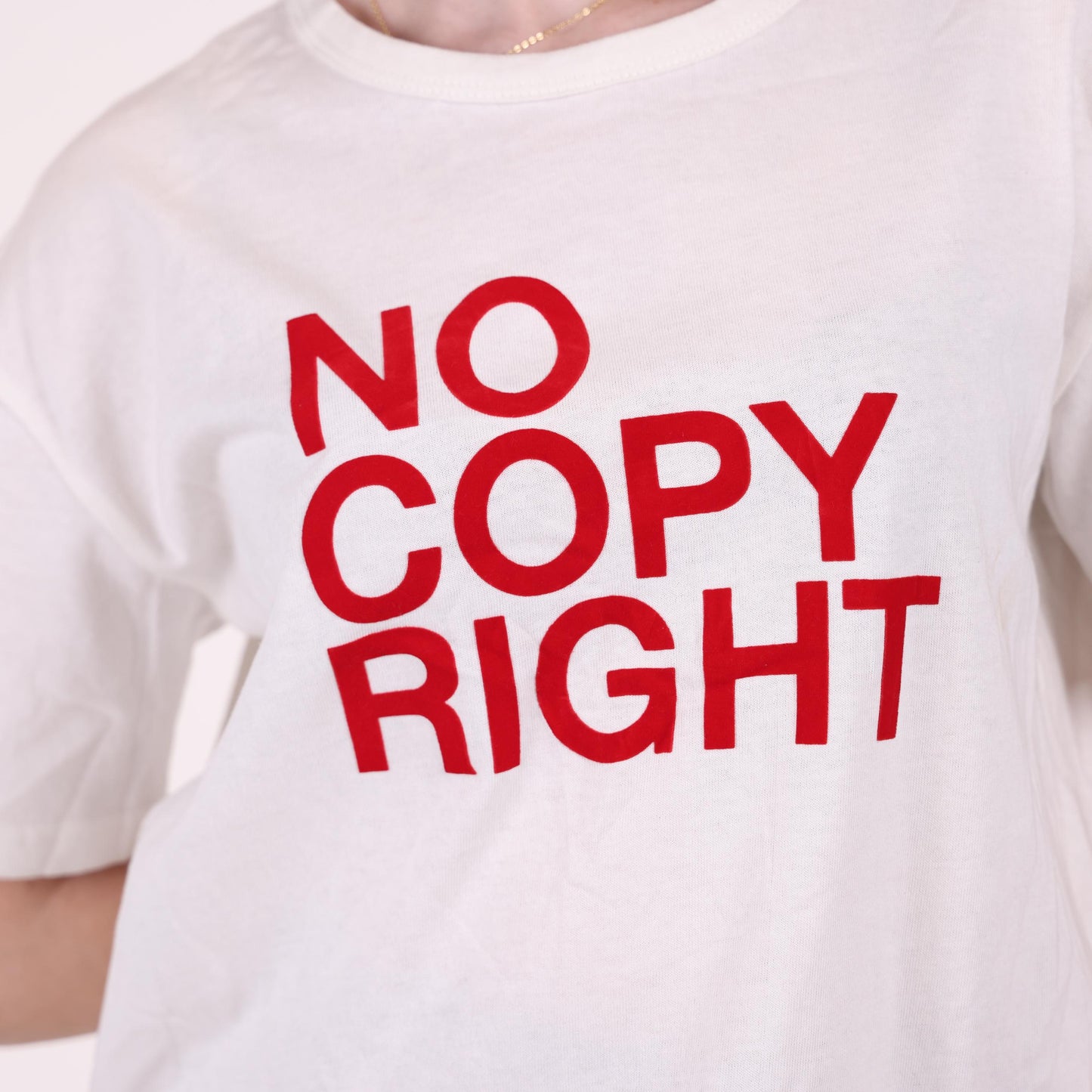 White Graphic T-Shirt with "No Copyright" Print