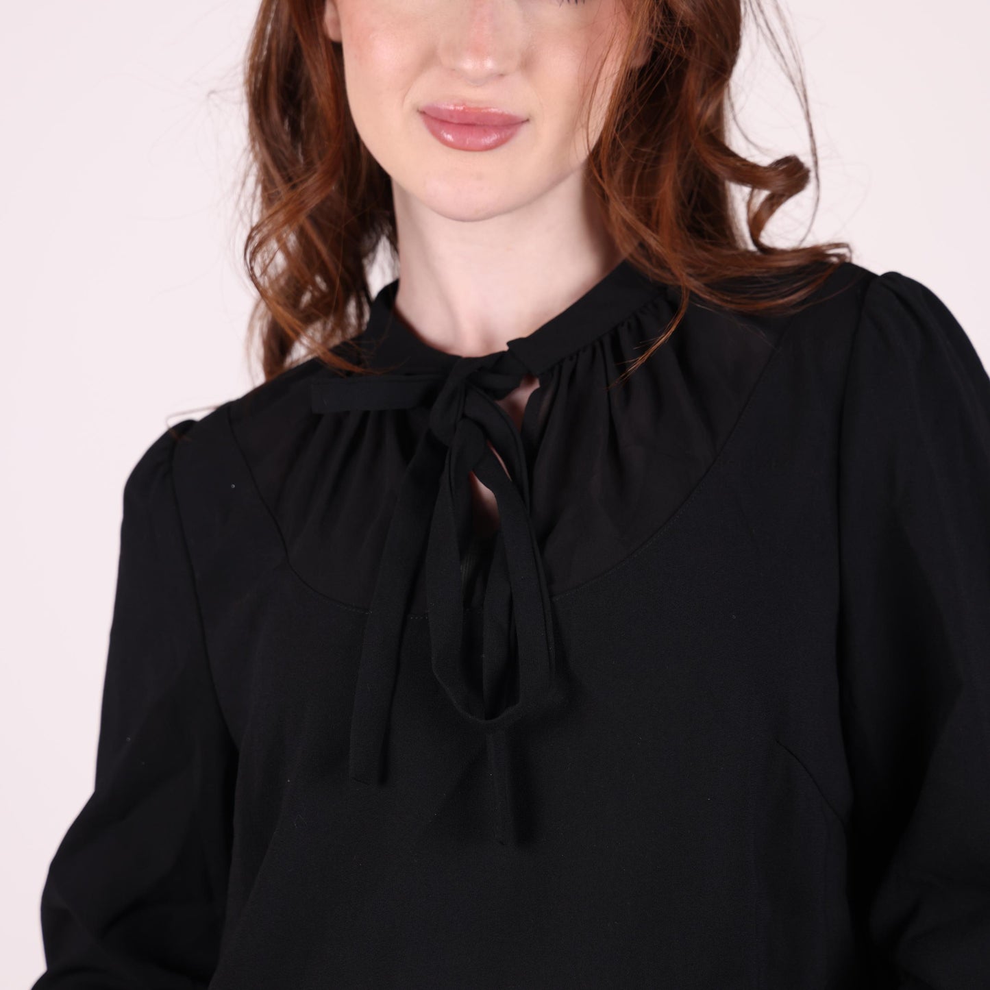 Black Long-Sleeve Peplum Blouse with Tie-Neck